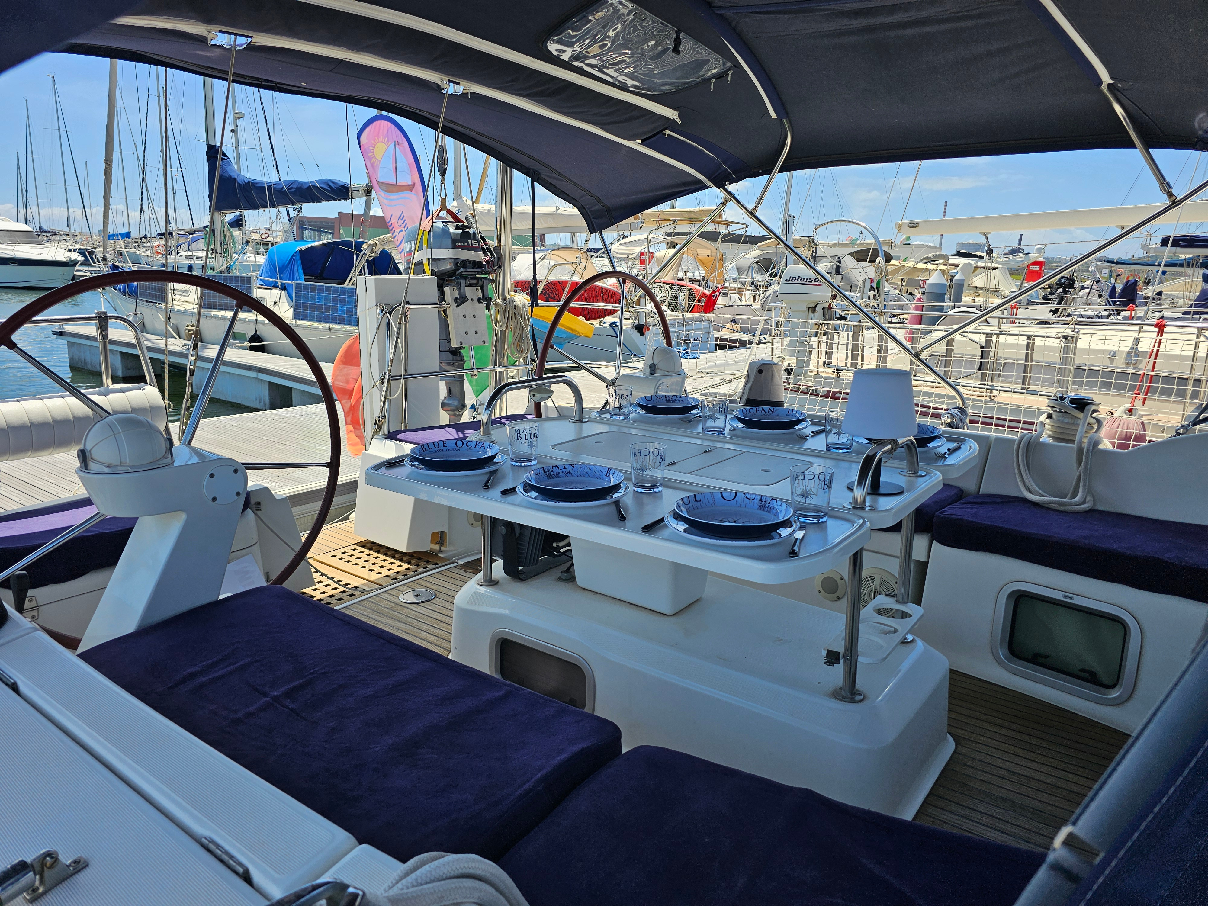 Dining area on sailing boat with blue ocean views